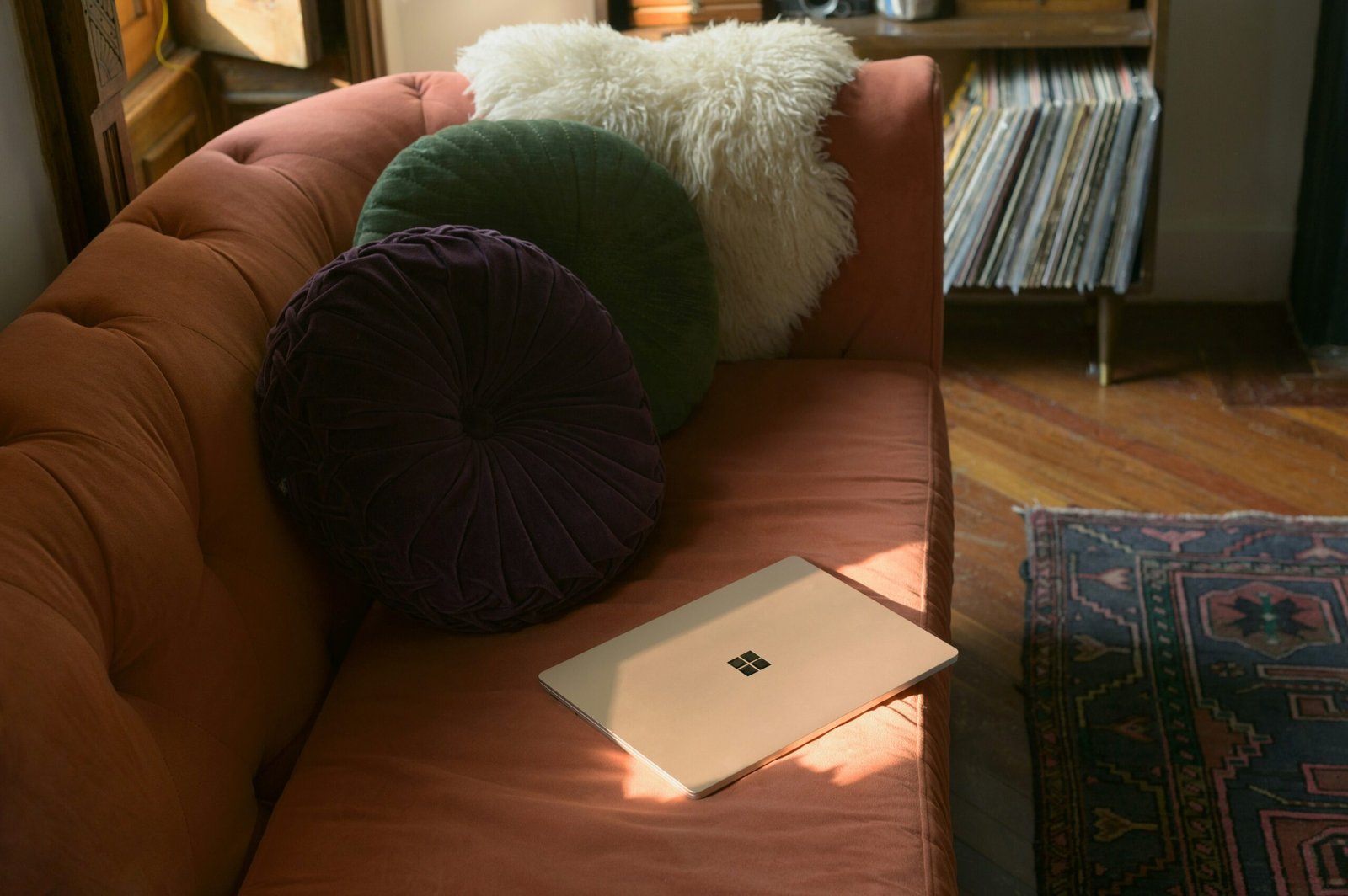 a laptop computer sitting on top of a couch